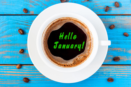 Hello January - text on morning coffee mug. Top view, New year hangover concept. Happy first month of the year